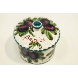 A Wemyss pottery biscuit box and cover, painted with plums, the cover inscribed "biscuits",