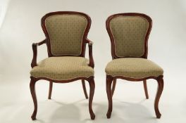 A set of six 20th Century dining chairs, each with carved legs and shaped backs.