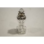 A silver mounted 'glug-glug' decanter with clear glass stopper, London 1898, 30cms high,