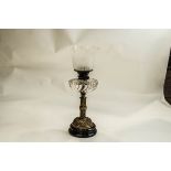 A VIctorian Oil lamp, with a spiral brass column and base,