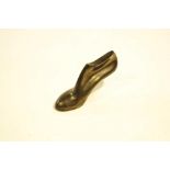 A C & J Clarks pewter paperweight in the form of a shoe,