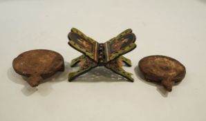 An Indian wooden folding book stand, polychrome decorated figures and foliage,