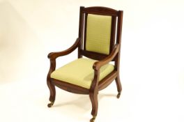 A Victorian mahogany open arm chair