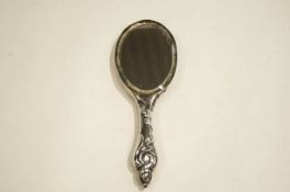 A silver backed mirror,
