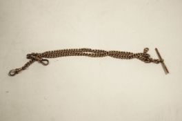 A 9 carat gold watch chain, of uniform solid curb links, with two swivels and a T bar, 35.