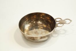 An American sterling reproduction bowl with a triple-ring pierced flat handle,
