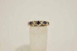 A 9 carat gold synthetic stone set eternity ring, finger size M1/2, 2.