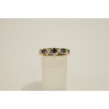 A 9 carat gold synthetic stone set eternity ring, finger size M1/2, 2.