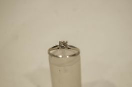 A 9 carat white gold ring, set with a single colourless stone, finger size L, 1.