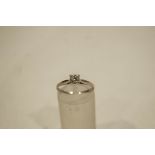 A 9 carat white gold ring, set with a single colourless stone, finger size L, 1.