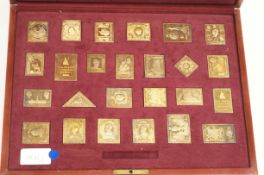 The Empire collection - a set of twenty five silver gilt reproductions of postage stamps,
