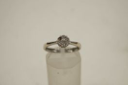 An 18 carat gold and diamond cluster ring, one setting vacant, finger size L1/2, 2.