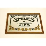 A Vintage Smiles Brewery framed bar mirror from 1979,