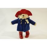 A Paddington Bear teddy by Rainbow designs, with hat, coat, wellies and tag.