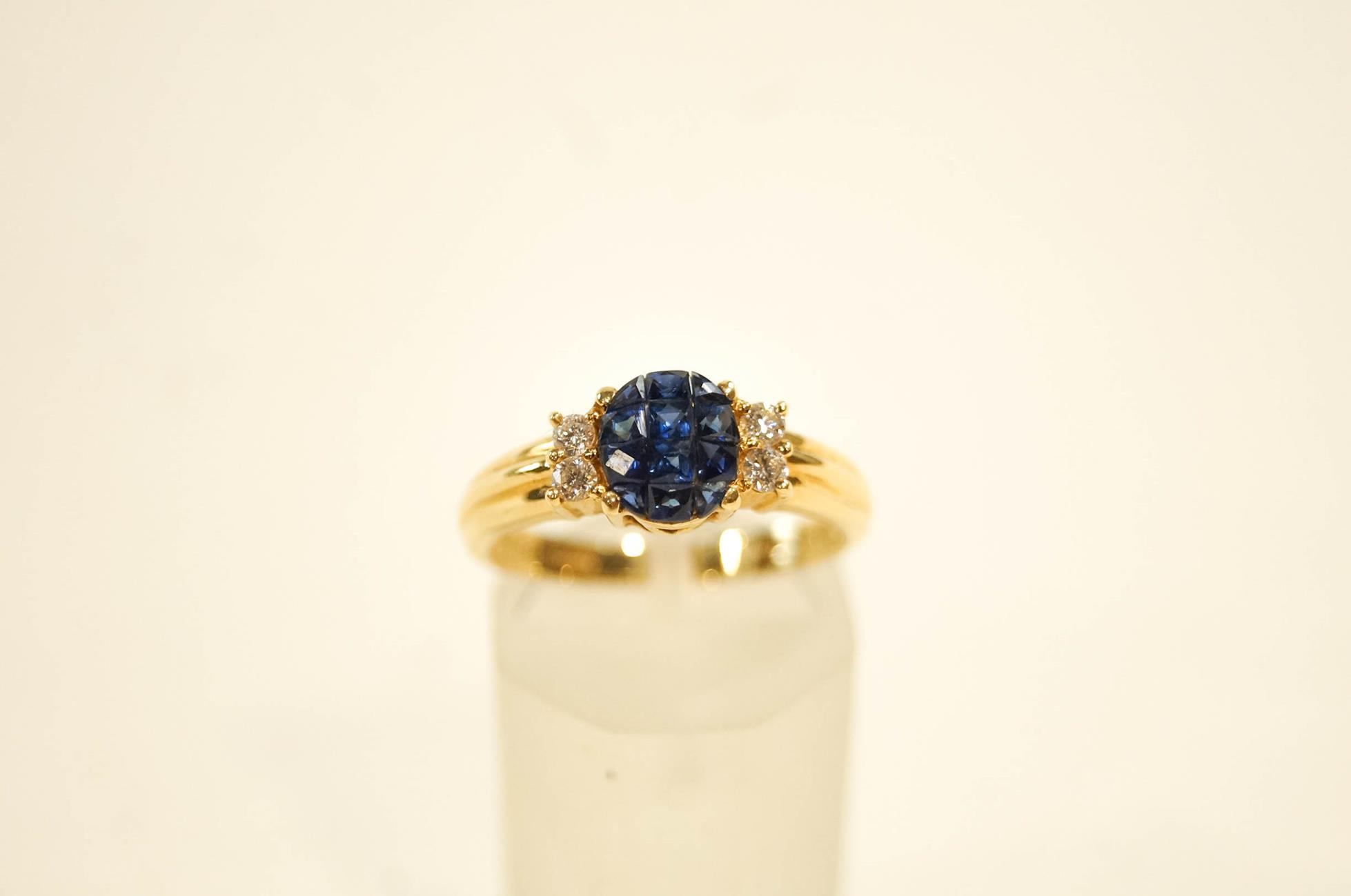 A diamond and calibre sapphire ring,