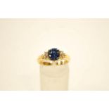 A diamond and calibre sapphire ring,
