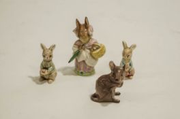 A Beswick Beatrix Potter Mrs Rabbit figure to include a Beswick model of a mouse and two un-marked