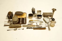 A collection of silver items, including a sugar caster,