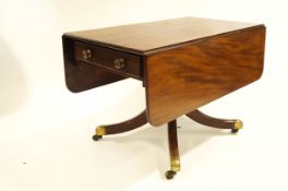A 19th Century mahogany drop leaf table with two drawers on turned pedestal base with splayed legs,