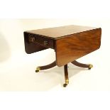 A 19th Century mahogany drop leaf table with two drawers on turned pedestal base with splayed legs,