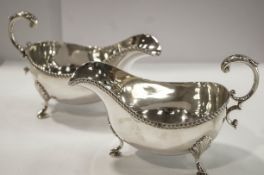 A pair of silver sauce boats, by Ellis & Co, Birmingham 1961, with cable border,