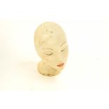 A mid 20th Century rubber female mannequin head