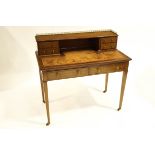 An Edwardian Hepplewhite revival inlaid mahogany leather top writing desk with tilted upstand,