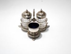 A Victorian silver trefoil cruet stand with beaded borders, a scroll handle, on three palmette feet,