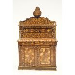 An unusual Victorian parquetry dresser, with all over specimen wood inlah,