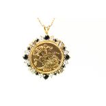 A 2000 half Sovereign, mounted to a stone set 9 carat gold pendant on a chain, 9.