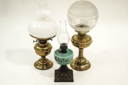 Two Victorian brass oil lamps with milk glass and etched shades,