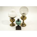 Two Victorian brass oil lamps with milk glass and etched shades,