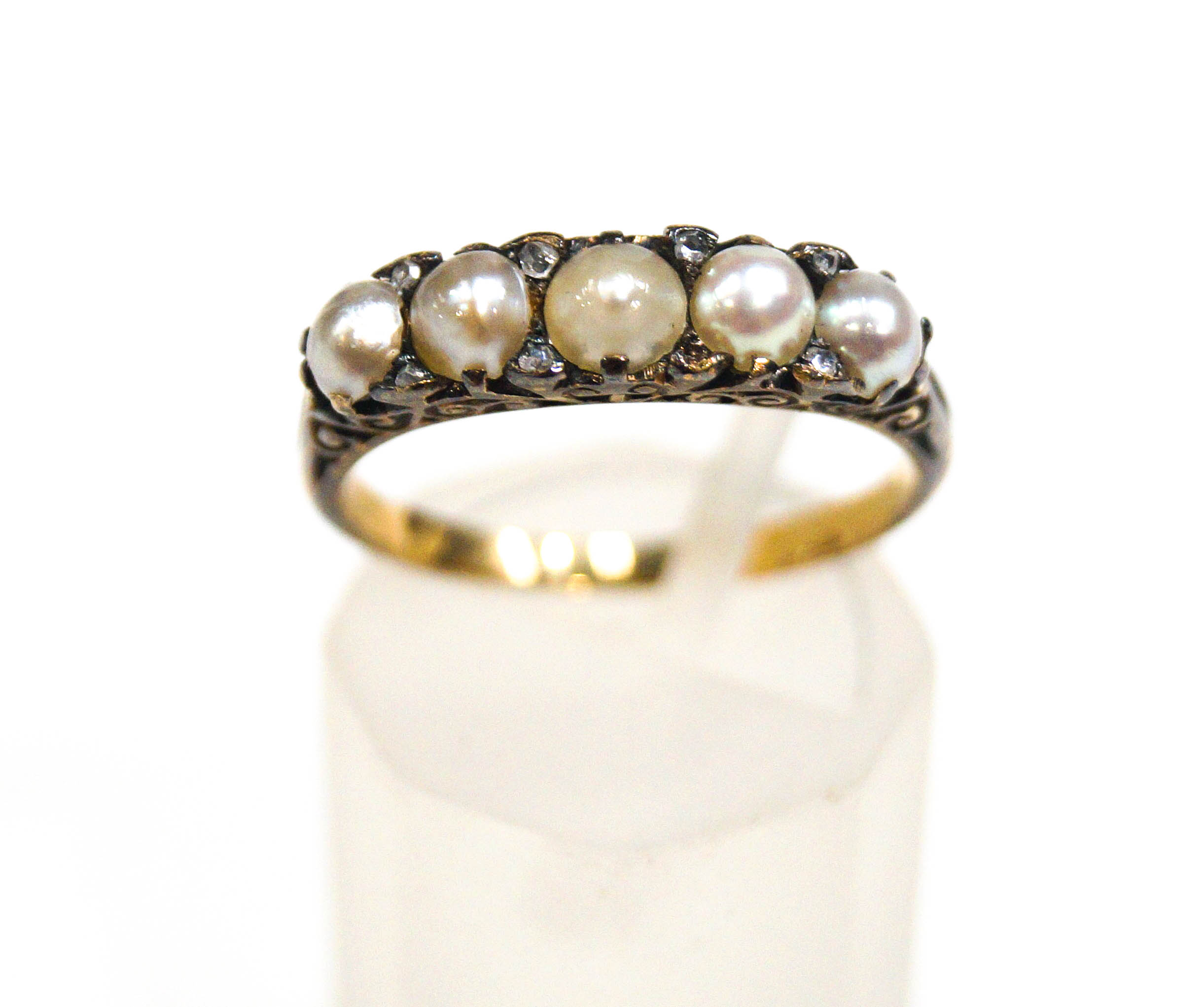 A late Victorian graduated pearl five stone carved half-hoop ring with rose diamon points, - Image 2 of 2