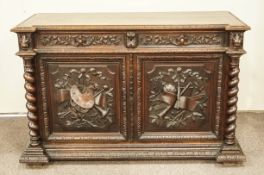 A 19th Century oak sideboard, carved in relief with barley twist sides,