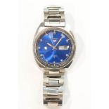 Seiko 5, a gentleman's stainless steel automatic watch, the round blue dial with steel batons,