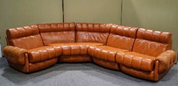 A Beauvale 1970s four piece modular leather suite, on casters,