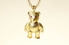 A 9 carat gold teddy bear pendant, with stone set eyes, on a 9 carat gold belcher link chain,