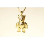 A 9 carat gold teddy bear pendant, with stone set eyes, on a 9 carat gold belcher link chain,