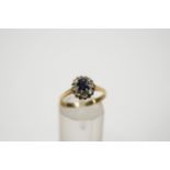 A small sapphire and diamond oval cluster ring,