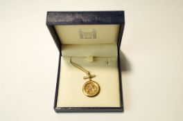 A 2003 half Sovereign, in a 9 carat gold diamond set pendant mount, on a chain, 11.4 g gross.