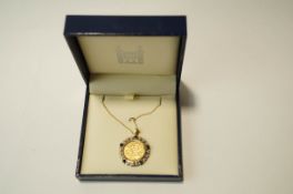 A 1907 half Sovereign, in a 9 carat gold sapphire and diamond pendant mount, on a chain, 11.