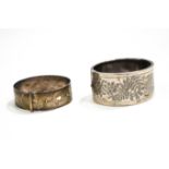 A silver bangle by Charles Horner,