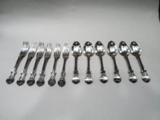 A composite set of six Victorian silver Victoria pattern dessert spoons and forks,