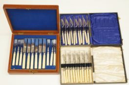 A cased set of twelve close plate fruit knives and forks, with carved ivory handles,