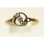 A three stone diamond ring, stamped '18ct',