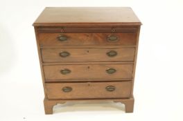 A 19th Century mahogany Batchelor's chest of four long drawers, with brushing slide,