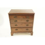 A 19th Century mahogany Batchelor's chest of four long drawers, with brushing slide,