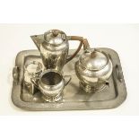 A 1920's/1930's five piece Pewter teaset, with hammered decoration,