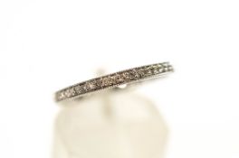 A 9 carat white gold and eighteen stone diamond half hoop ring,