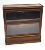 A Globe Wernicke oak two section bookcase, with original label,